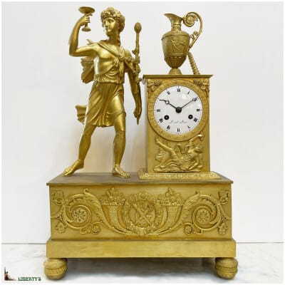 Pendule empire bronze doré au mercure, sujet Bacchus, signée Duval à Paris, mouvement avec suspension à fil de soie, haut. 44 cm, (1810-1820)