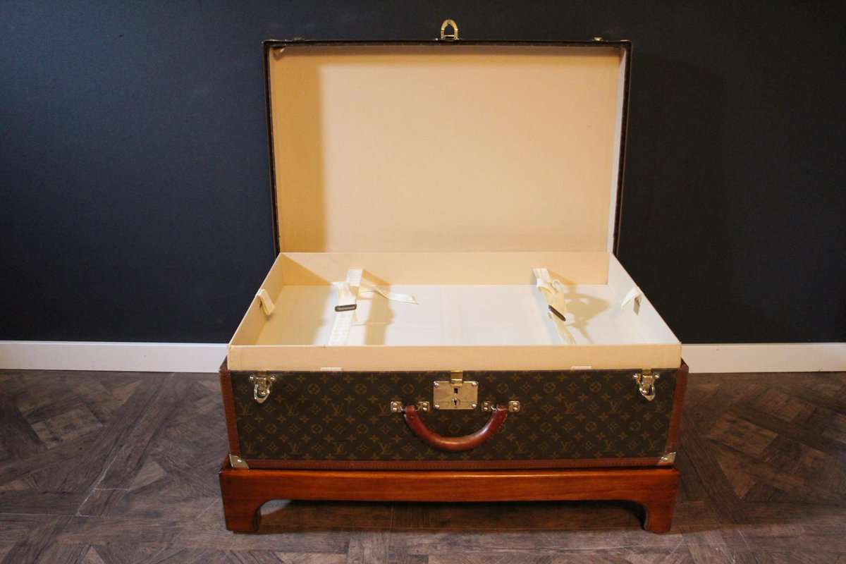 Louis Vuitton Alzer 80 suitcase, Louis Vuitton steamer trunk - Les Puces de  Paris Saint-Ouen